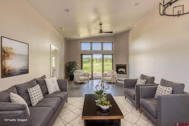 2785 Rock Rd Unit A, Pagosa Springs, CO 81147 - living room with a ceiling fan, vaulted ceiling, and light wood-style flooring