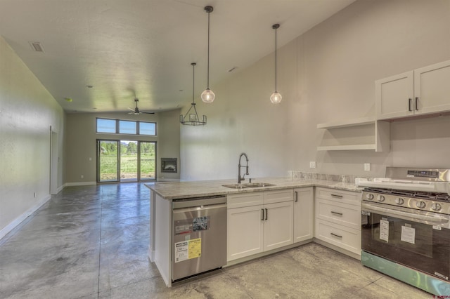 2785 Rock Rd Unit A, Pagosa Springs, CO 81147 - kitchen featuring stainless steel appliances, white cabinetry, a sink, and a peninsula