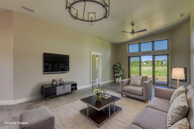 2785 Rock Rd Unit A, Pagosa Springs, CO 81147 - living area featuring baseboards, visible vents, and ceiling fan with notable chandelier
