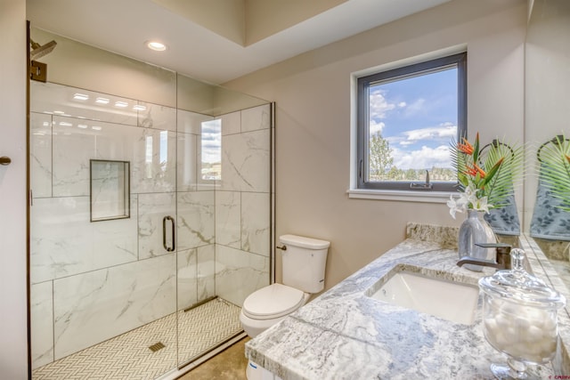 bathroom featuring recessed lighting, a marble finish shower, toilet, and vanity