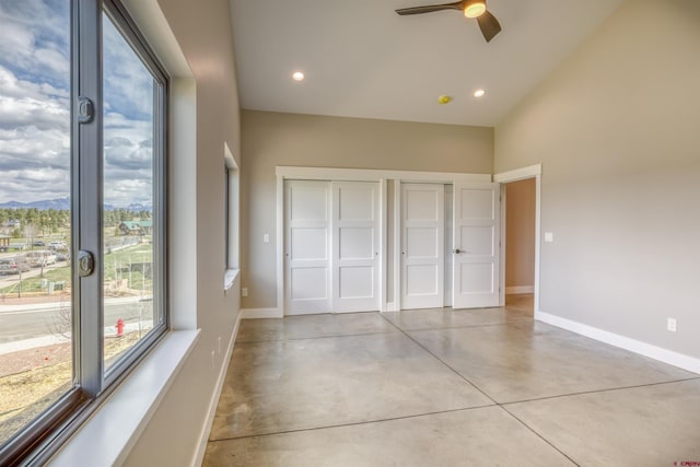unfurnished bedroom featuring baseboards, recessed lighting, finished concrete flooring, and a ceiling fan