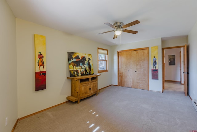 bedroom with baseboards, a closet, light carpet, and ceiling fan