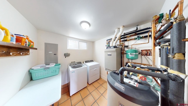 18812 Rd 27, Dolores, CO 81323 - laundry area featuring gas water heater, electric panel, laundry area, washing machine and dryer, and light tile patterned floors