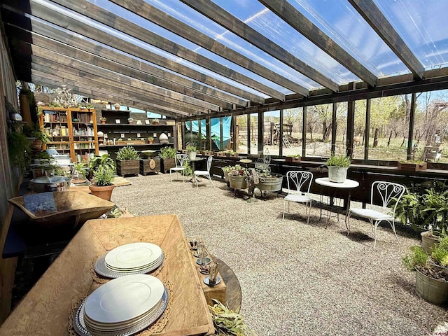 exterior space featuring vaulted ceiling