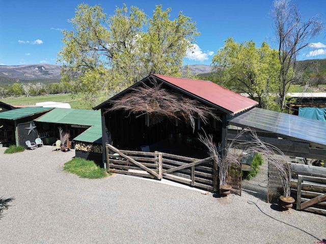 view of stable with a mountain view