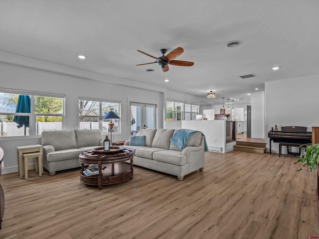 living area with recessed lighting, ceiling fan, light wood finished floors, and visible vents
