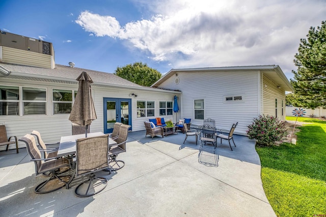 view of patio / terrace with french doors, outdoor dining area, and an outdoor hangout area