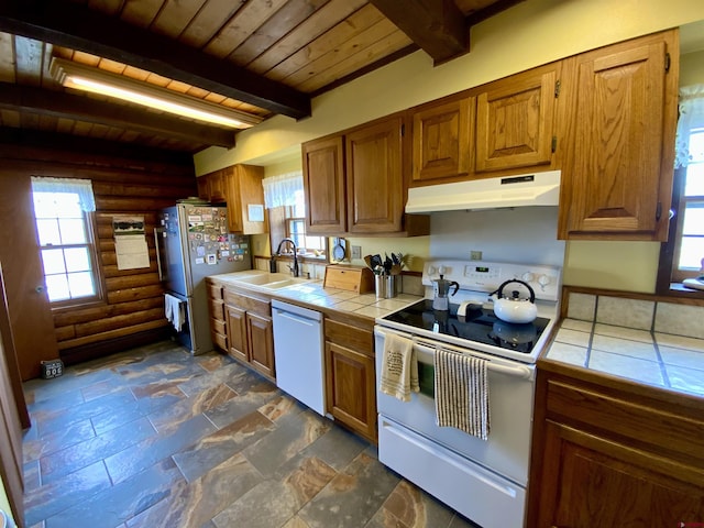 409 Sierra Vista Way, Gunnison, CO 81230 - kitchen featuring tile countertops, a sink, wooden ceiling, under cabinet range hood, and white appliances