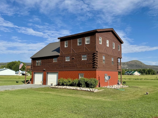 409 Sierra Vista Way, Gunnison, CO 81230 - view of side of property featuring a mountain view, a yard, gravel driveway, and log siding