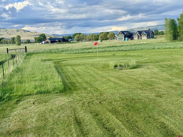 409 Sierra Vista Way, Gunnison, CO 81230 - view of yard featuring a mountain view, fence, and a rural view