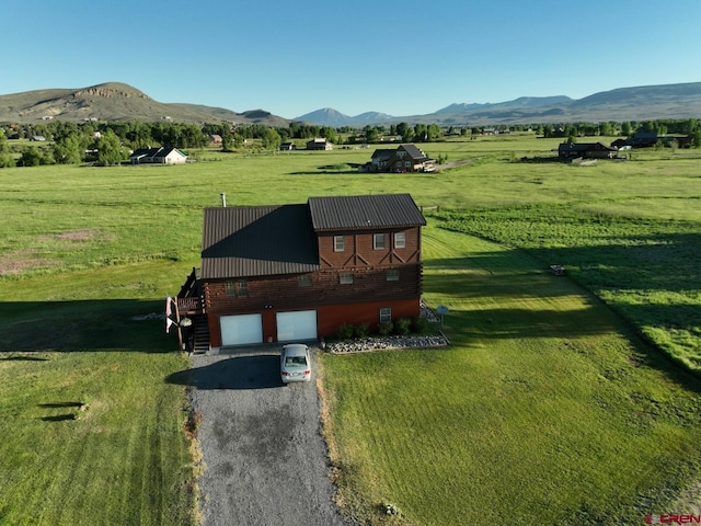 409 Sierra Vista Way, Gunnison, CO 81230 - view of home's community with a yard, a rural view, a mountain view, and a garage