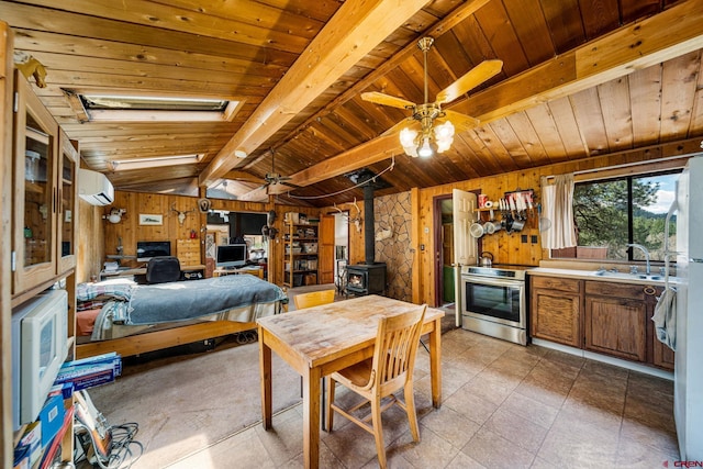 2229 Bear Creek Rd, Bayfield, CO 81122 - interior space featuring a wood stove, wood walls, wood ceiling, a wall mounted AC, and a sink