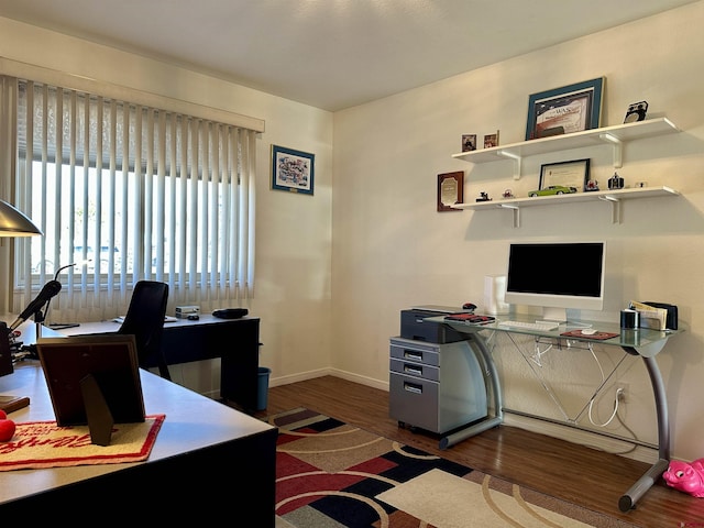 office featuring baseboards and wood finished floors
