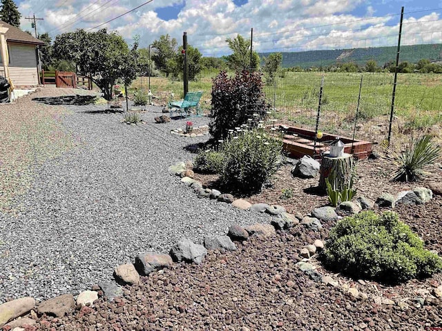 view of yard featuring a garden and fence