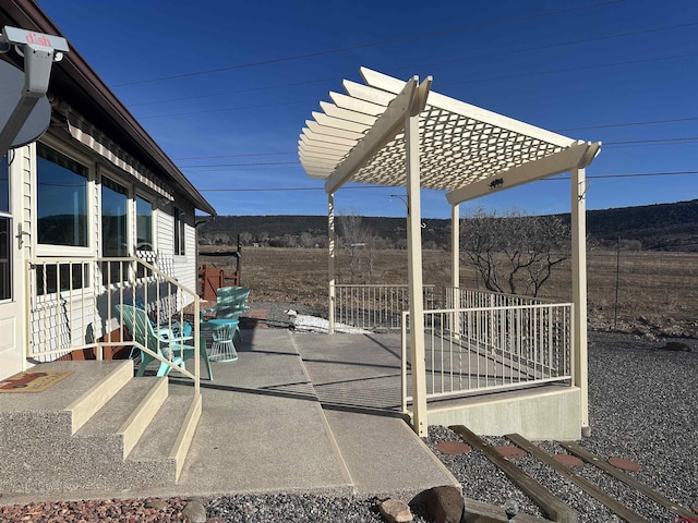 view of patio featuring fence