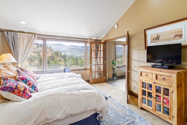 bedroom with baseboards, carpet flooring, and vaulted ceiling