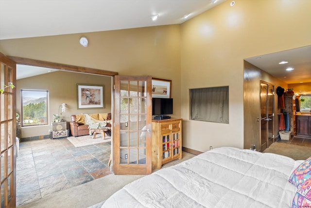 bedroom with recessed lighting, baseboards, multiple windows, and stone finish flooring