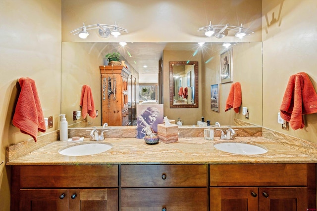 full bath featuring double vanity and a sink