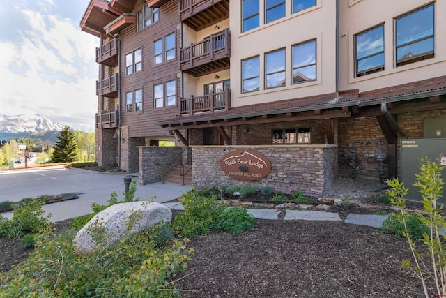 view of building exterior featuring a mountain view