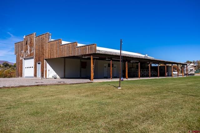 rear view of property with a lawn