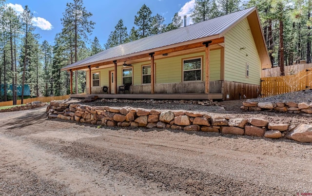 561 Sierra Dr, Durango, CO 81301 - back of house featuring fence, ceiling fan, a porch, and metal roof