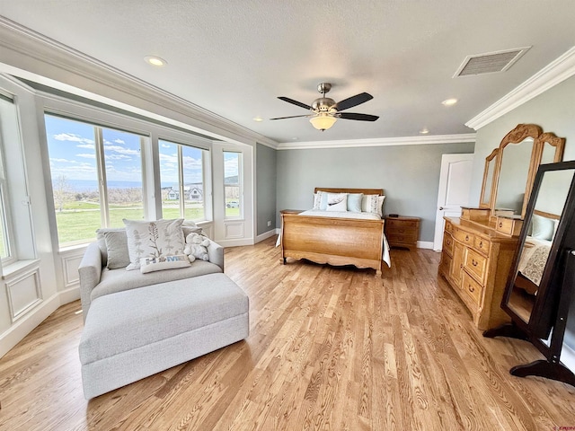 22876 Thunder Mountain Ln, Cedaredge, CO 81413 - bedroom featuring baseboards, visible vents, ornamental molding, and light wood-style flooring