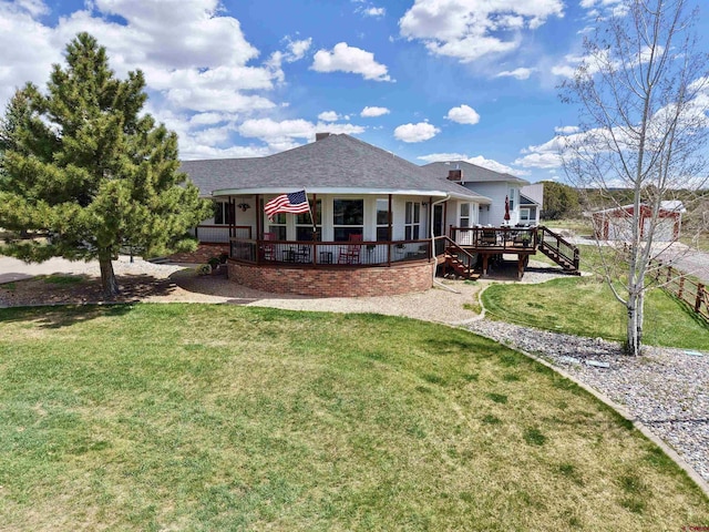 22876 Thunder Mountain Ln, Cedaredge, CO 81413 - back of property with a shingled roof, a wooden deck, a yard, and stairway