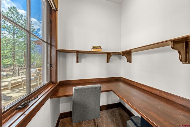 unfurnished office with built in desk