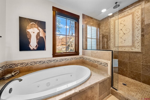 full bathroom featuring a tub with jets and a tile shower