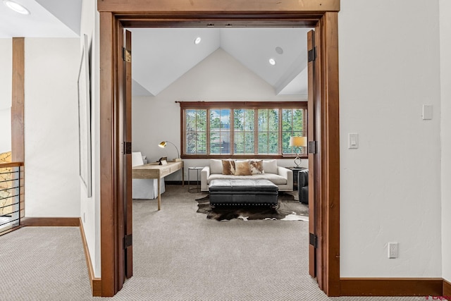 interior space with carpet floors, recessed lighting, baseboards, and lofted ceiling
