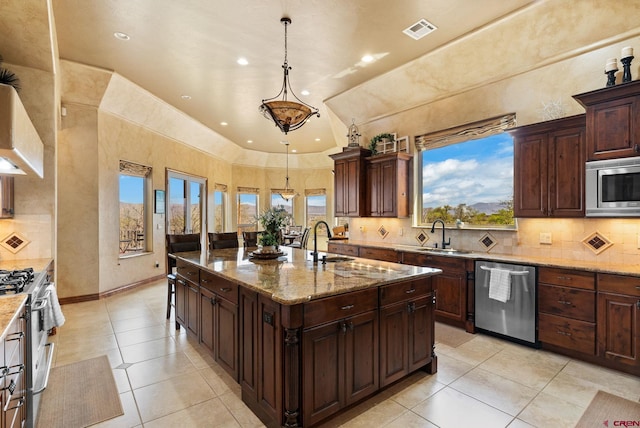 714 Washington Ct, Grand Junction, CO 81507 - kitchen featuring appliances with stainless steel finishes, a sink, light tile patterned floors, backsplash, and recessed lighting