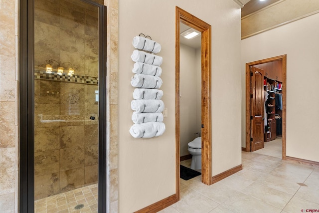 714 Washington Ct, Grand Junction, CO 81507 - full bath featuring a shower stall, tile patterned flooring, toilet, baseboards, and a spacious closet