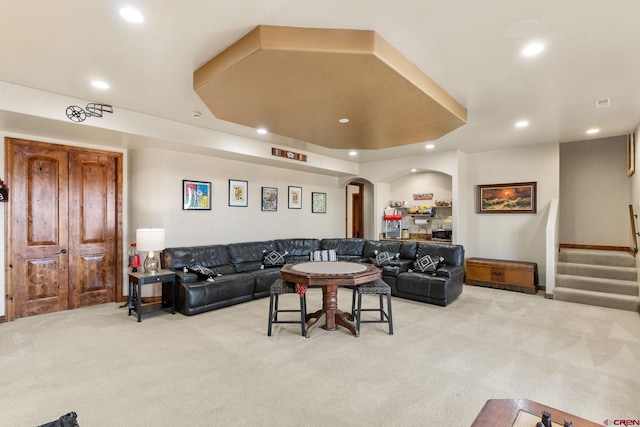 714 Washington Ct, Grand Junction, CO 81507 - living area featuring light colored carpet, arched walkways, recessed lighting, and stairway