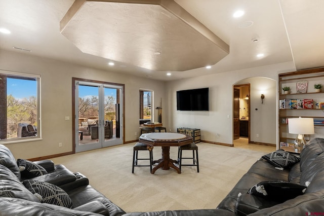 714 Washington Ct, Grand Junction, CO 81507 - living area featuring arched walkways, recessed lighting, light carpet, and baseboards