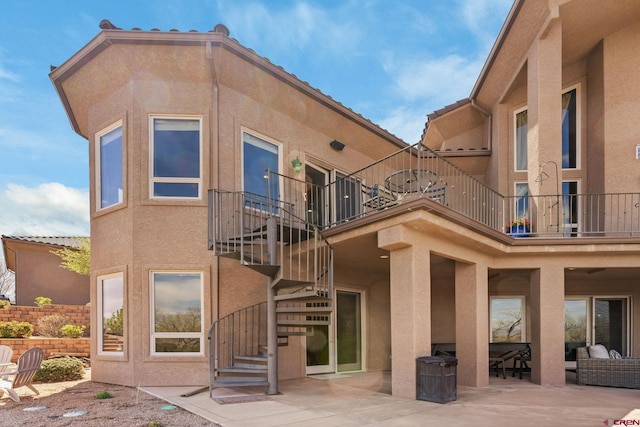 714 Washington Ct, Grand Junction, CO 81507 - rear view of house featuring a balcony, stairway, stucco siding, and a patio area