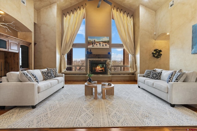 714 Washington Ct, Grand Junction, CO 81507 - living room with a high ceiling, wood finished floors, and a glass covered fireplace