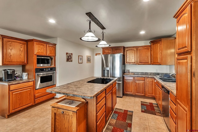 kitchen with brown cabinetry, pendant lighting, appliances with stainless steel finishes, a center island, and light tile patterned floors