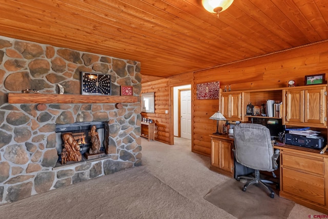 office with wood ceiling, rustic walls, a stone fireplace, and light carpet