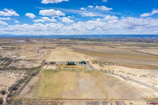 bird's eye view featuring view of desert and a rural view
