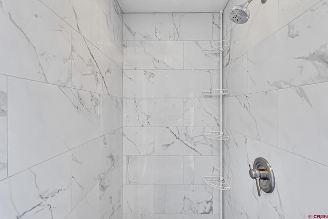details with a tile shower
