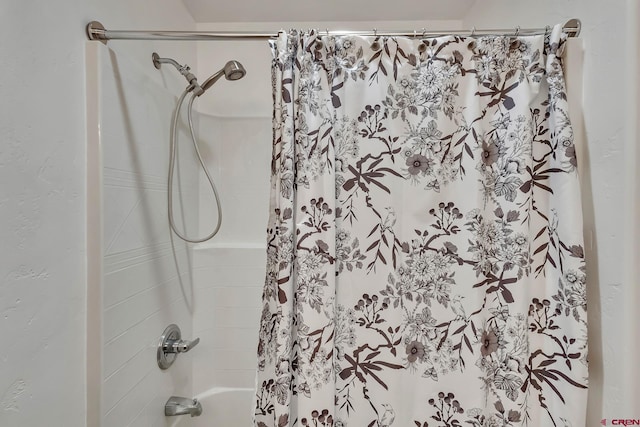 bathroom featuring shower / bath combo with shower curtain