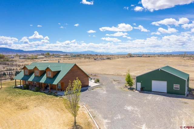 birds eye view of property with a rural view and a mountain view