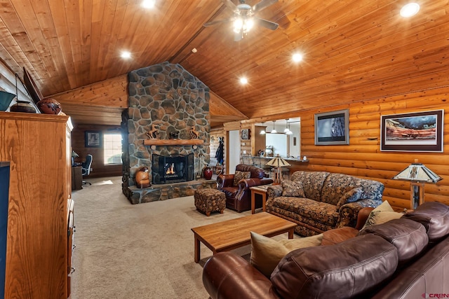 carpeted living room with ceiling fan, a stone fireplace, wood ceiling, and rustic walls