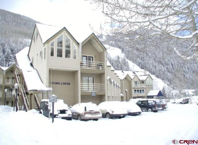 exterior space featuring a balcony and stucco siding