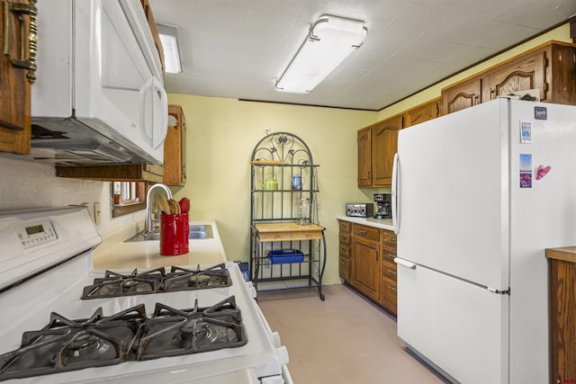 kitchen with brown cabinets, concrete flooring, a sink, white appliances, and light countertops