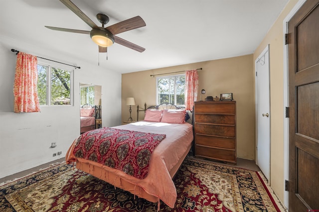 carpeted bedroom with ceiling fan