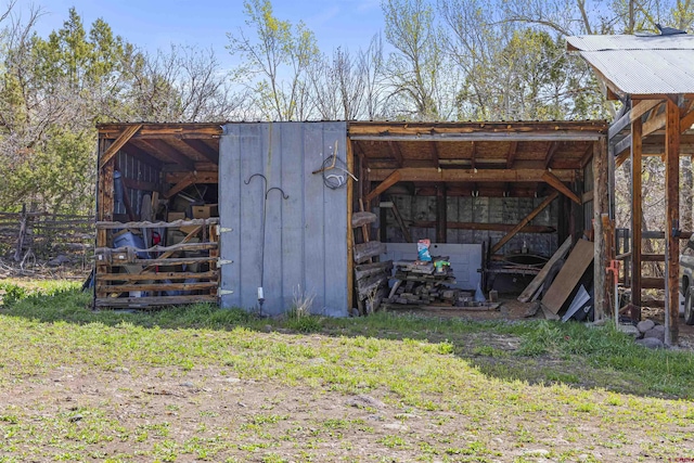 view of pole building with fence