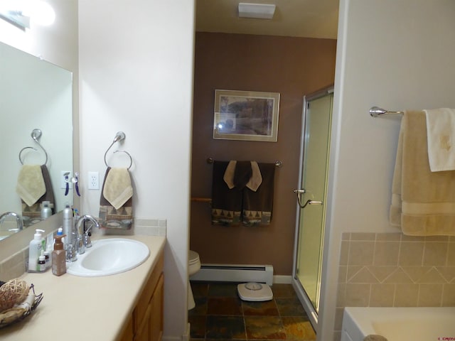 bathroom with a baseboard heating unit, vanity, toilet, and a shower stall