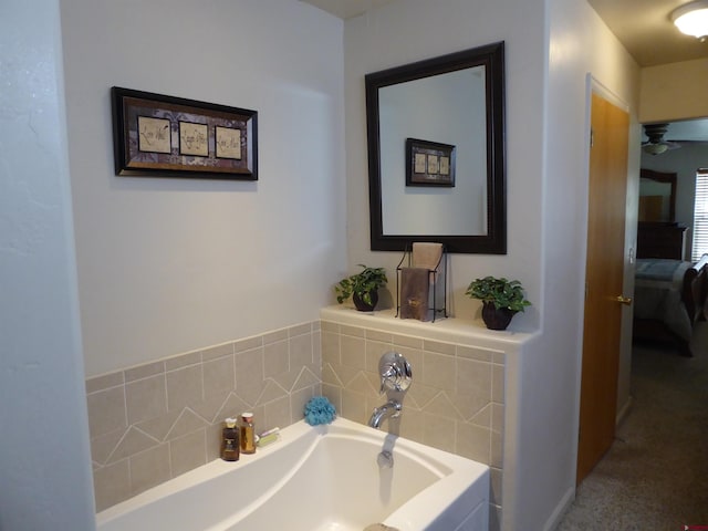 full bath featuring ceiling fan, ensuite bath, and a garden tub