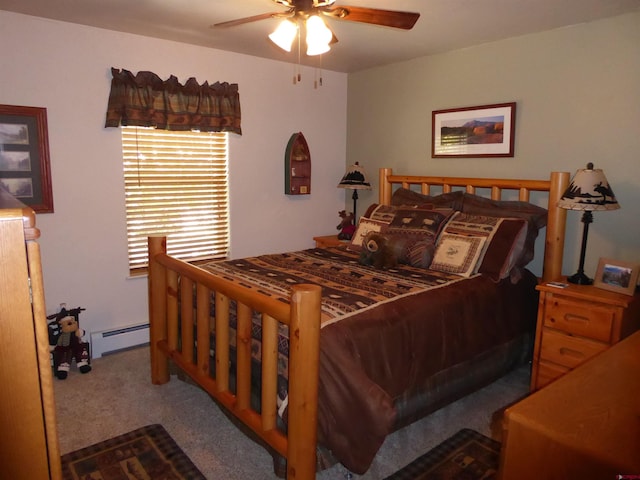 carpeted bedroom with a ceiling fan and baseboard heating